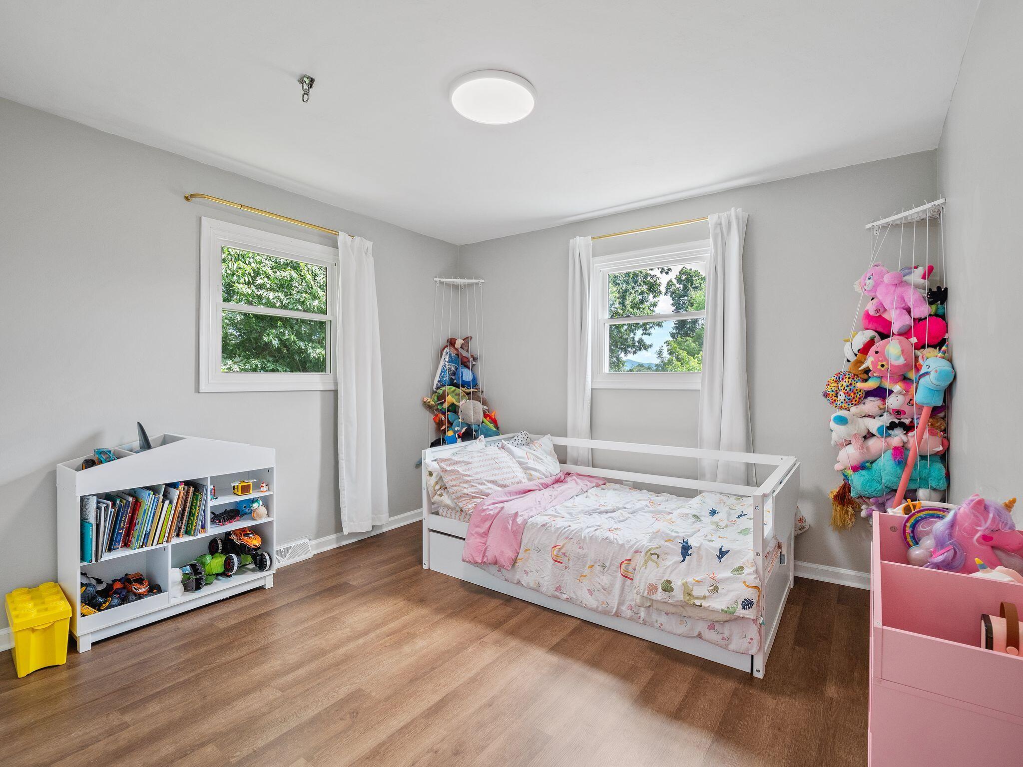 1701 Glendon Road Salem, VA 24153 - Photo 34 of 43 a bedroom with bed and a wooden floor