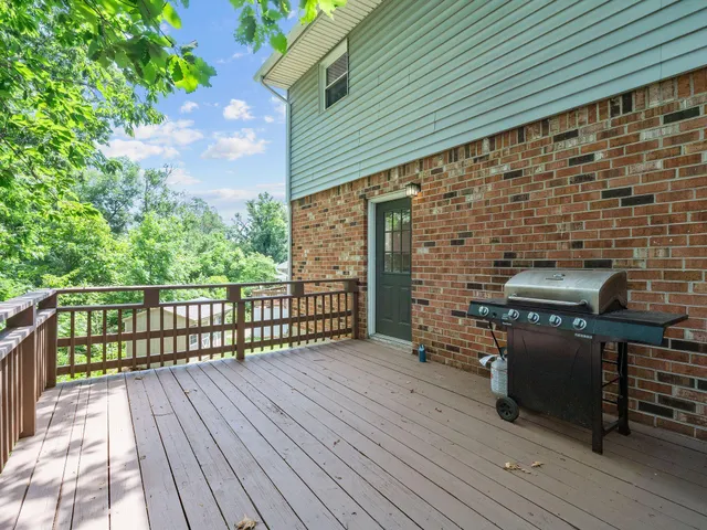 a view of a balcony with wooden floor