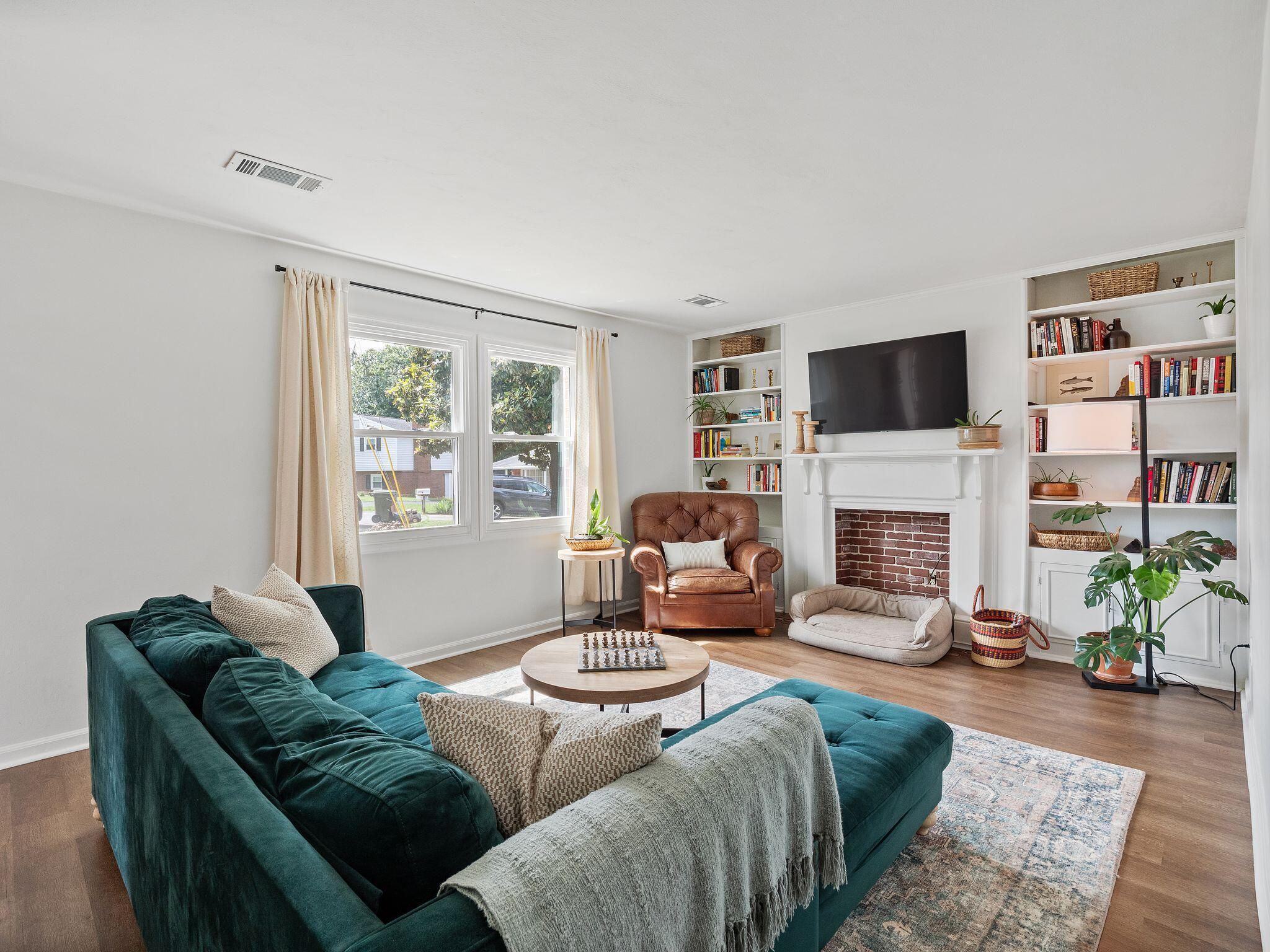 1701 Glendon Road Salem, VA 24153 - Photo 5 of 43 a living room with furniture a fireplace and a flat screen tv