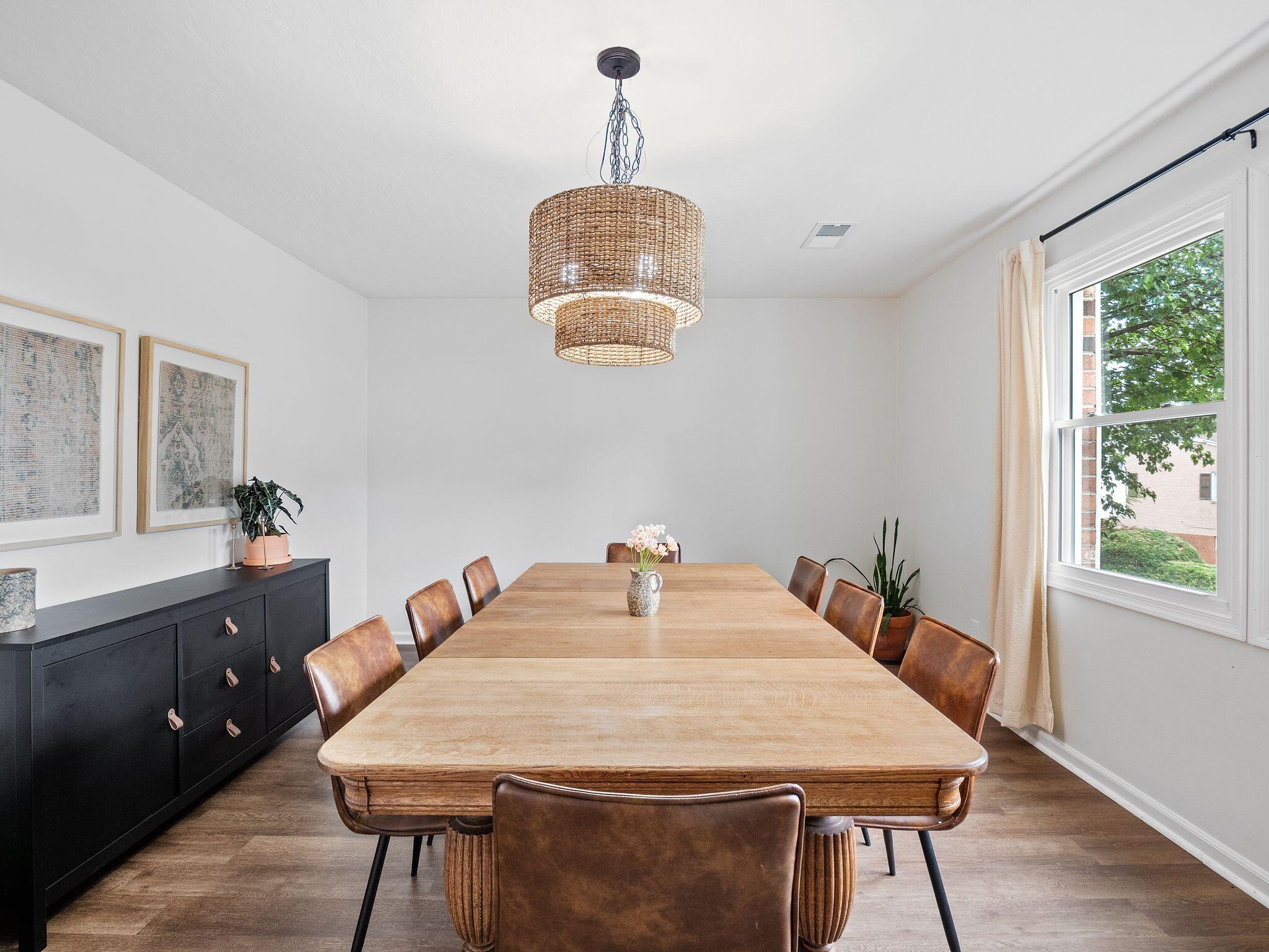 1701 Glendon Road Salem, VA 24153 - Photo 8 of 43 a dining room with a table chairs and a wooden floor
