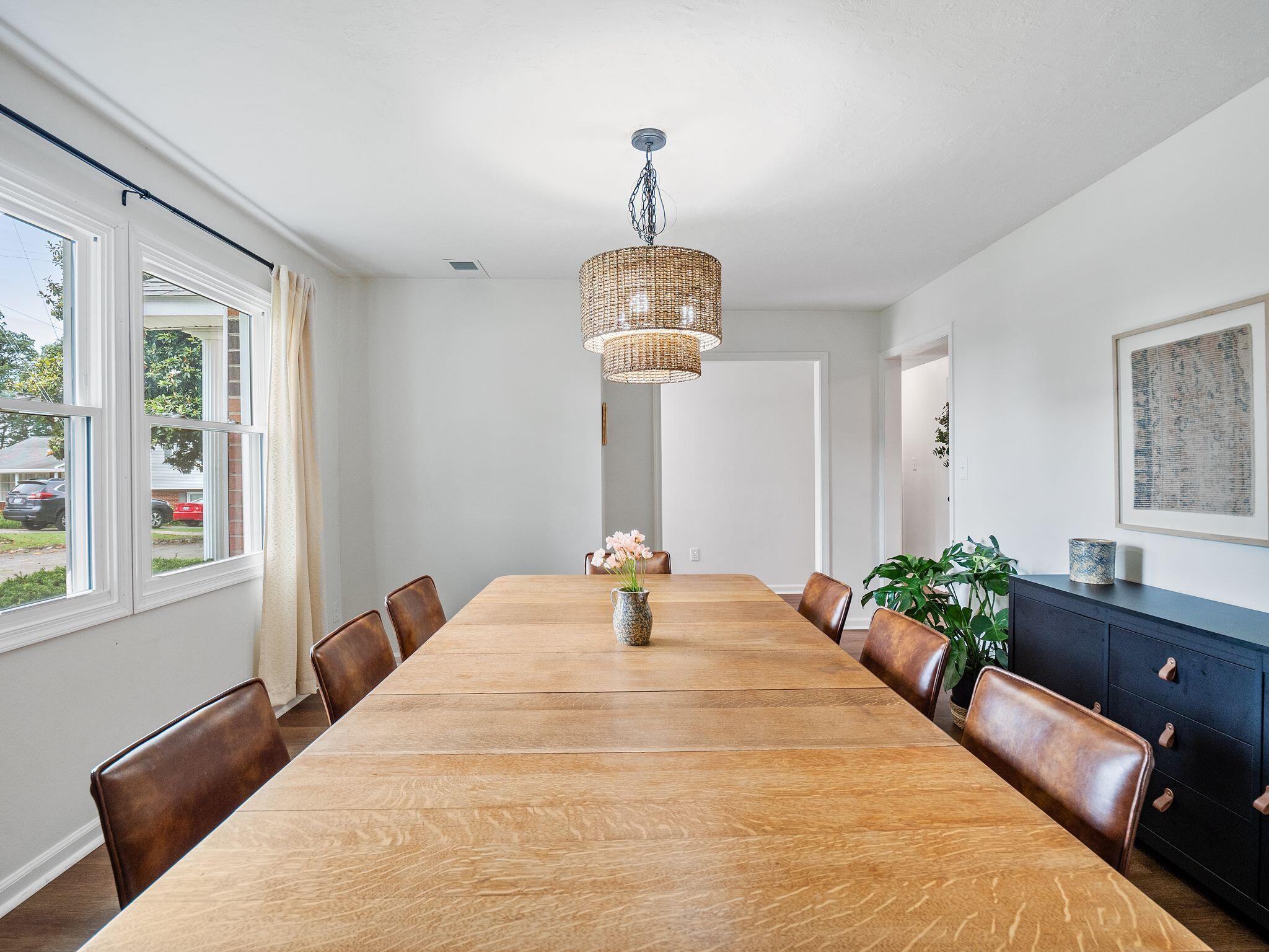 1701 Glendon Road Salem, VA 24153 - Photo 9 of 43 a bedroom with a bed and a chandelier