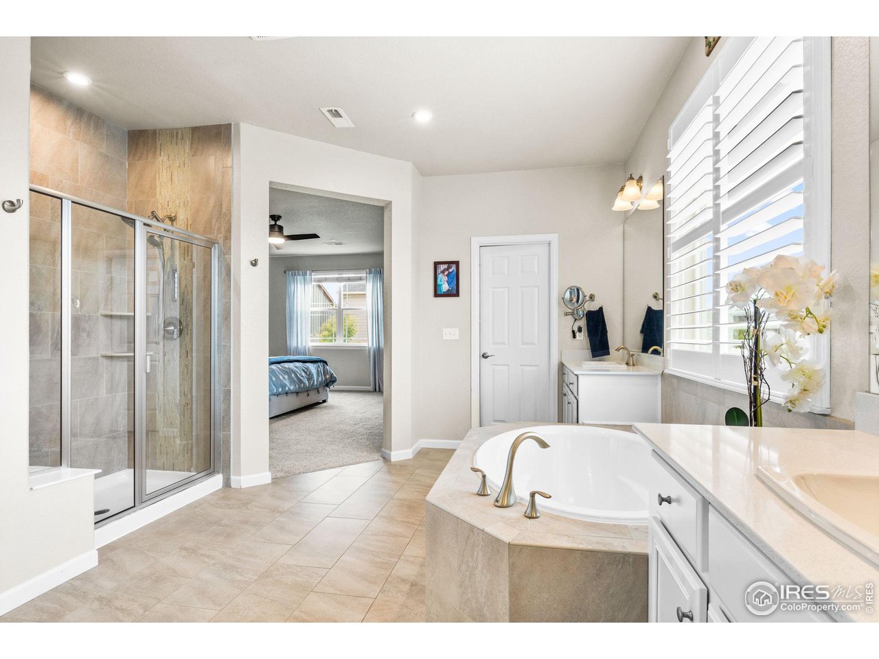 803 Old Wagon Trail Circle Lafayette, CO 80026 - Photo 15 of 30 a living room with furniture a large window and wooden floor