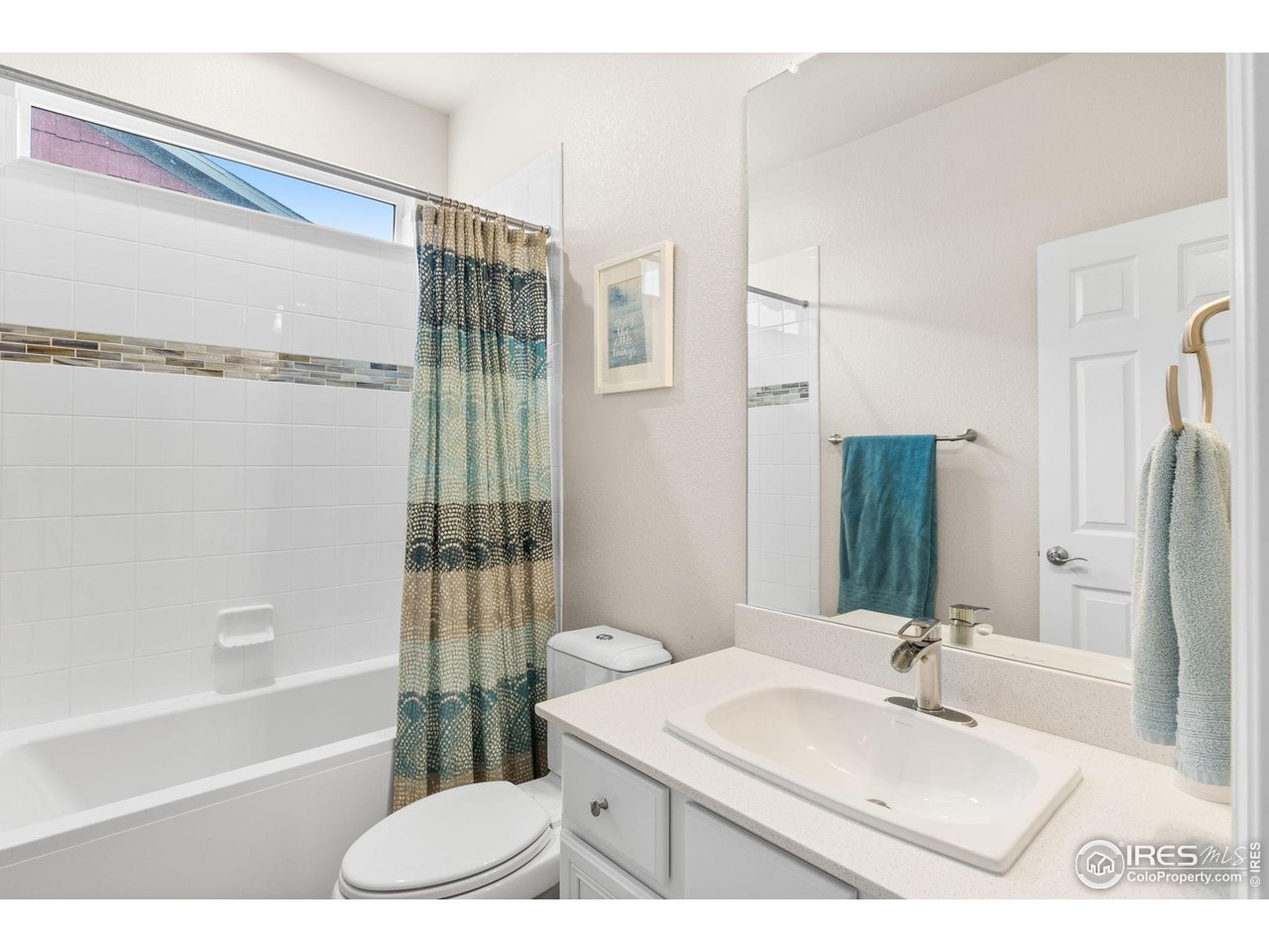 803 Old Wagon Trail Circle Lafayette, CO 80026 - Photo 18 of 30 a bathroom with a sink vanity granite tub shower and a mirror