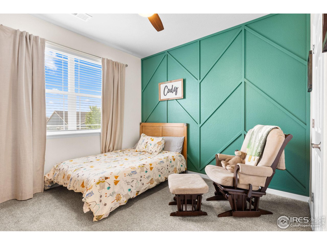 803 Old Wagon Trail Circle Lafayette, CO 80026 - Photo 19 of 30 a bedroom with a bed and furniture