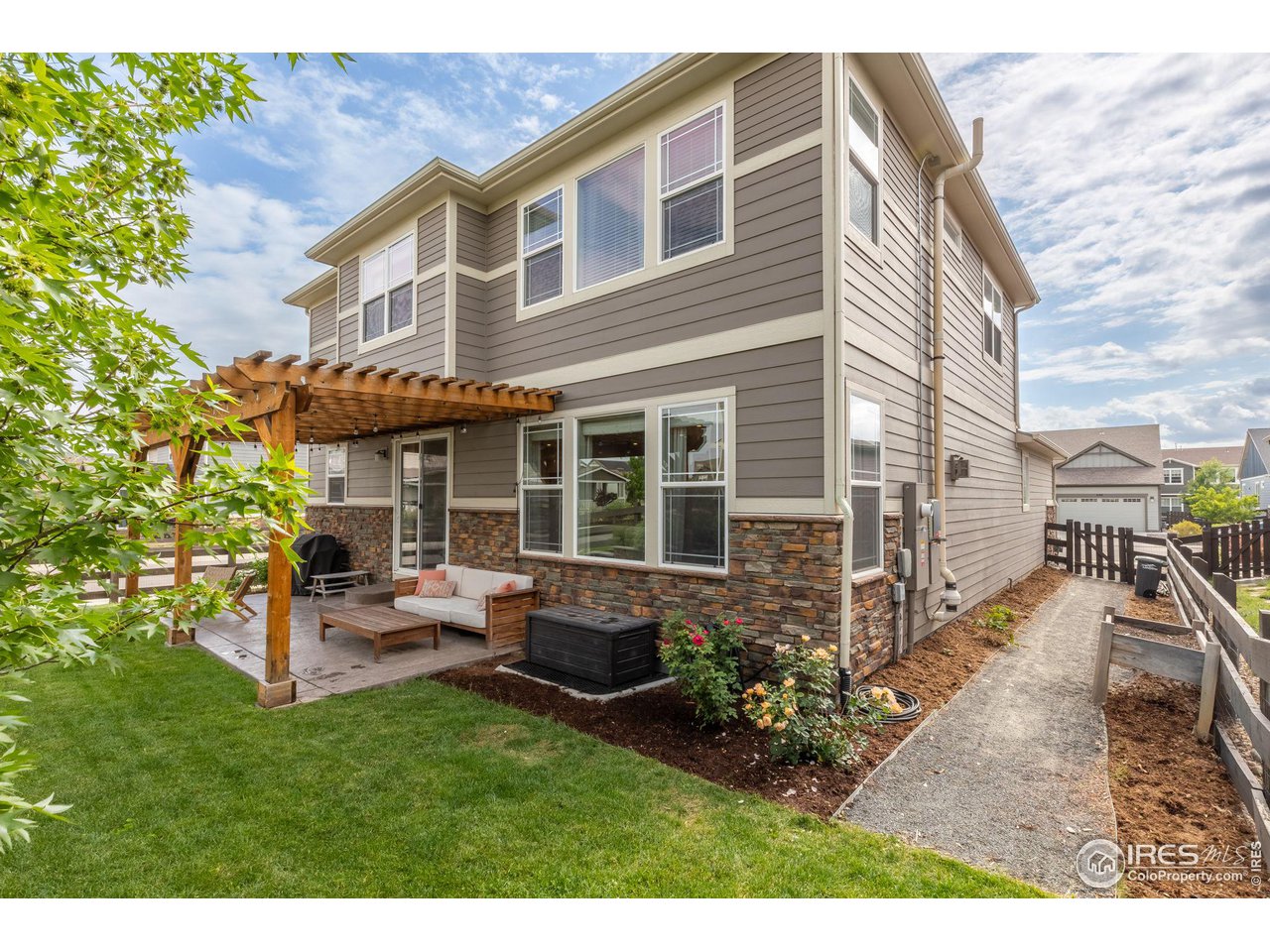 803 Old Wagon Trail Circle Lafayette, CO 80026 - Photo 23 of 30 a view of a house with a patio