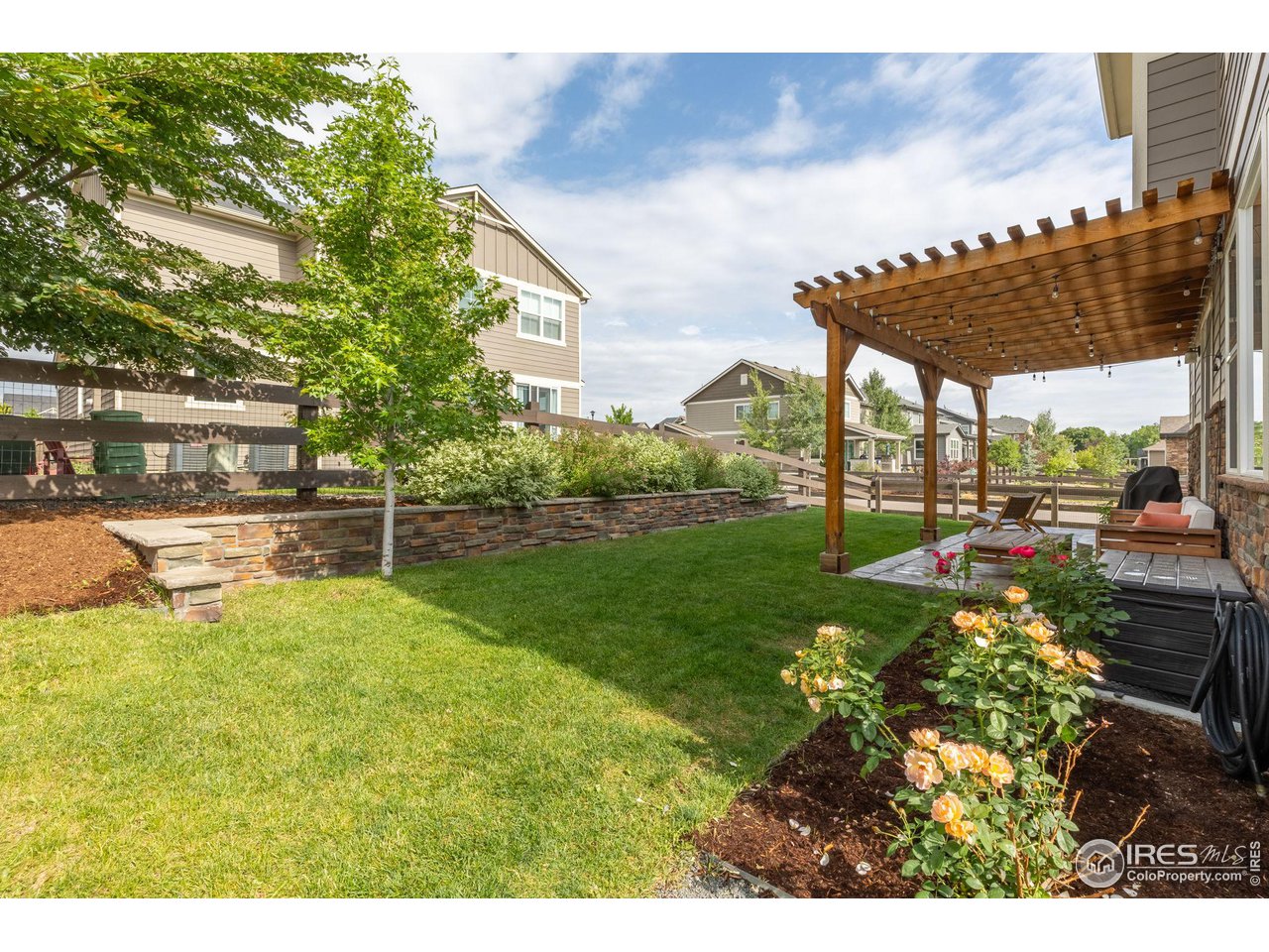 803 Old Wagon Trail Circle Lafayette, CO 80026 - Photo 25 of 30 a view of a backyard with sitting area
