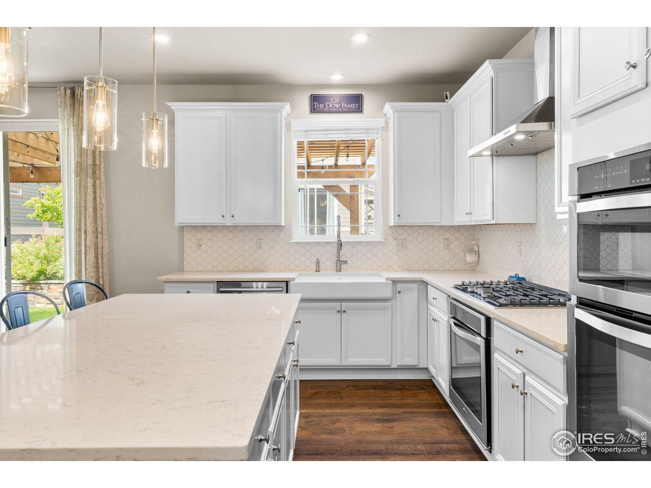 803 Old Wagon Trail Circle Lafayette, CO 80026 - Photo 4 of 30 a kitchen with a stove a sink and a refrigerator