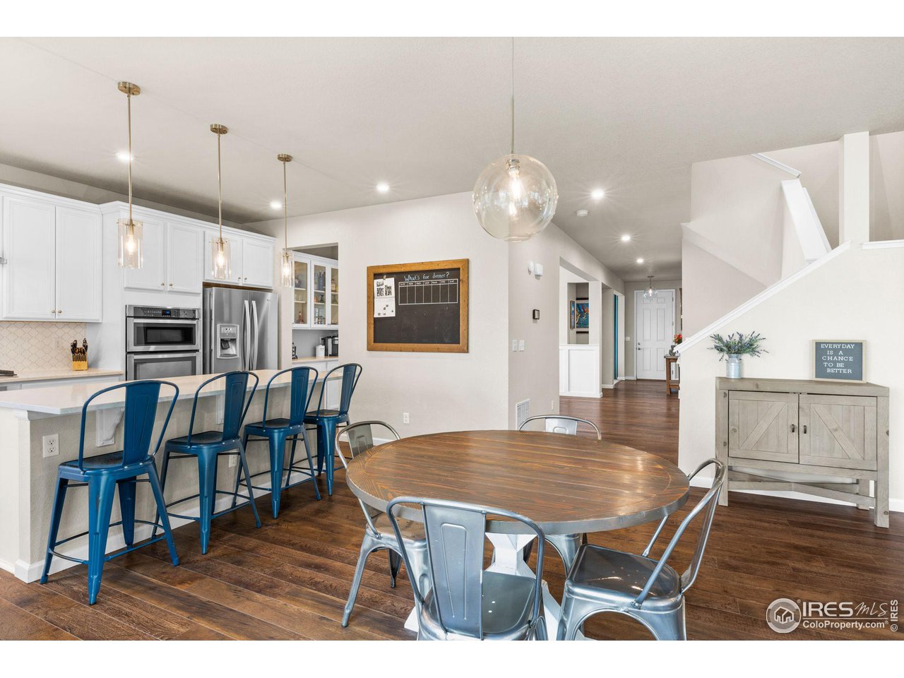 803 Old Wagon Trail Circle Lafayette, CO 80026 - Photo 6 of 30 a dining room with furniture and wooden floor