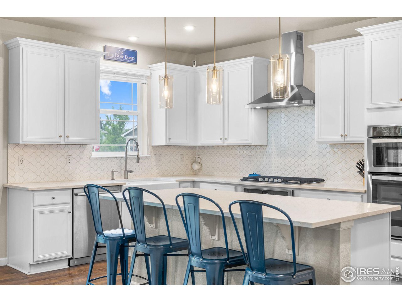 803 Old Wagon Trail Circle Lafayette, CO 80026 - Photo 7 of 30 a kitchen with stainless steel appliances granite countertop a sink a stove a refrigerator and cabinets