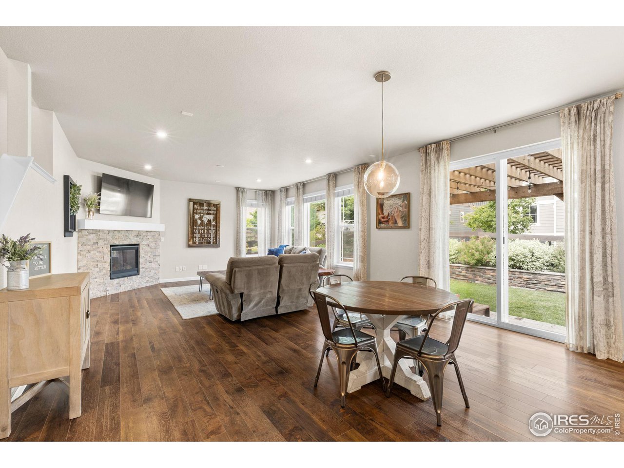 803 Old Wagon Trail Circle Lafayette, CO 80026 - Photo 8 of 30 a view of a dining room with furniture window and wooden floor
