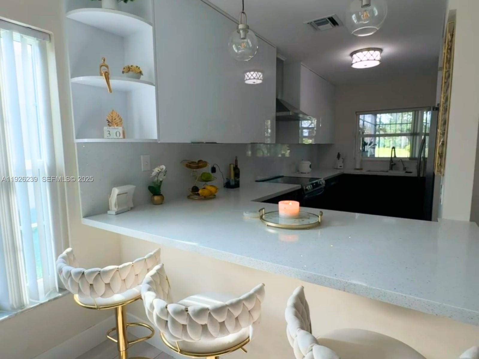 19066 Bob-O-Link Drive Hialeah, FL 33015 - Photo 4 of 11 a kitchen with a table and chairs