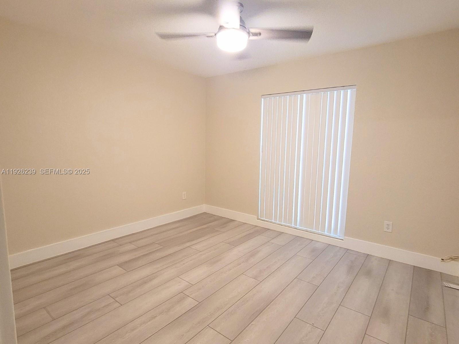 19066 Bob-O-Link Drive Hialeah, FL 33015 - Photo 9 of 11 wooden floor in an empty room