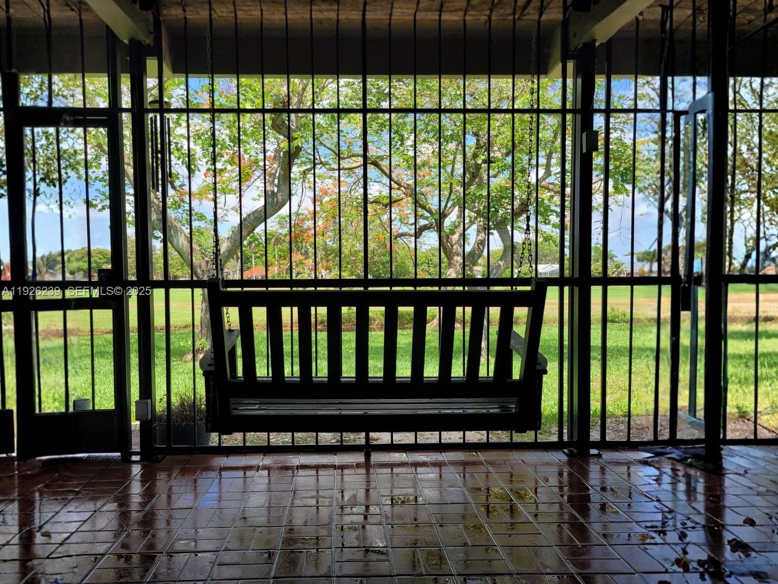 19066 Bob-O-Link Drive Hialeah, FL 33015 - Photo 10 of 11 a view of a black and white house