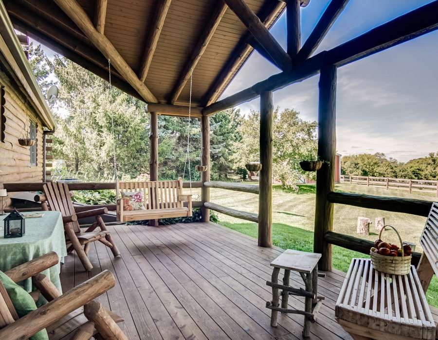 608 Hunter Road Caledonia, IL 61011 - Photo 4 of 25 a balcony with wooden floor and outdoor seating