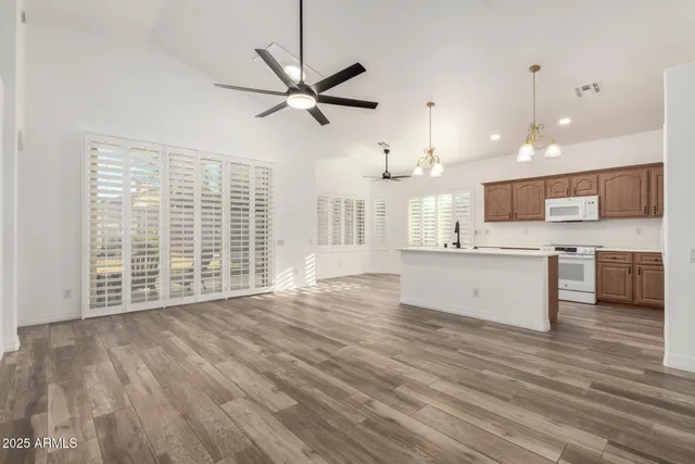 a view of a kitchen with a sink and a window