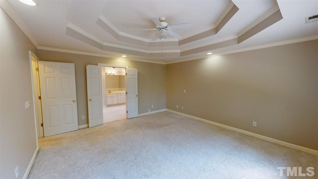 8212 Gaspari Court Raleigh, NC 27615 - Photo 11 of 18 an empty room with a bathroom and a shower