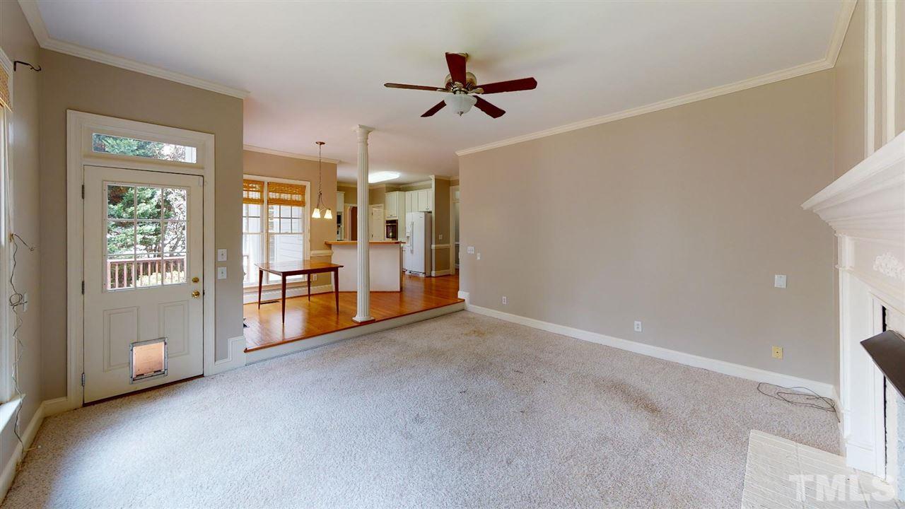 8212 Gaspari Court Raleigh, NC 27615 - Photo 7 of 18 a view of a livingroom with a ceiling fan and window