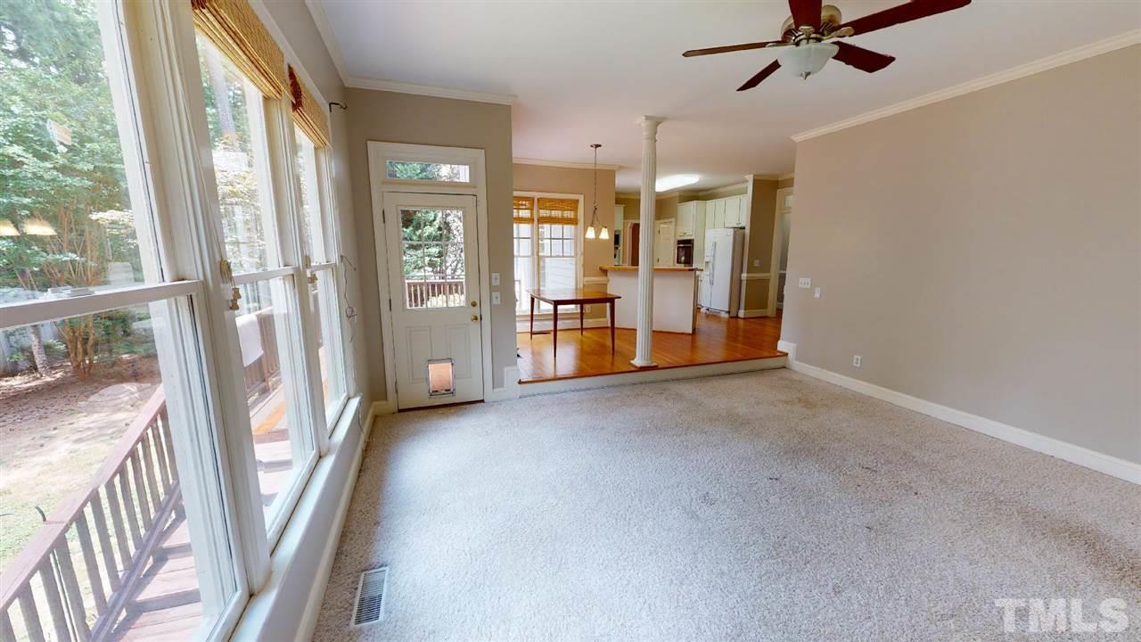 8212 Gaspari Court Raleigh, NC 27615 - Photo 8 of 18 a view of an empty room with a fireplace