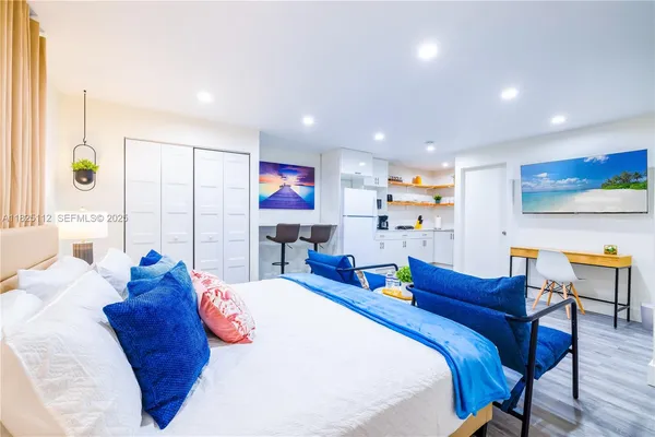 a bed room with a bed window and table