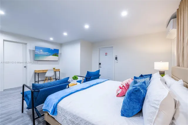 a bedroom with a bed and a table in it