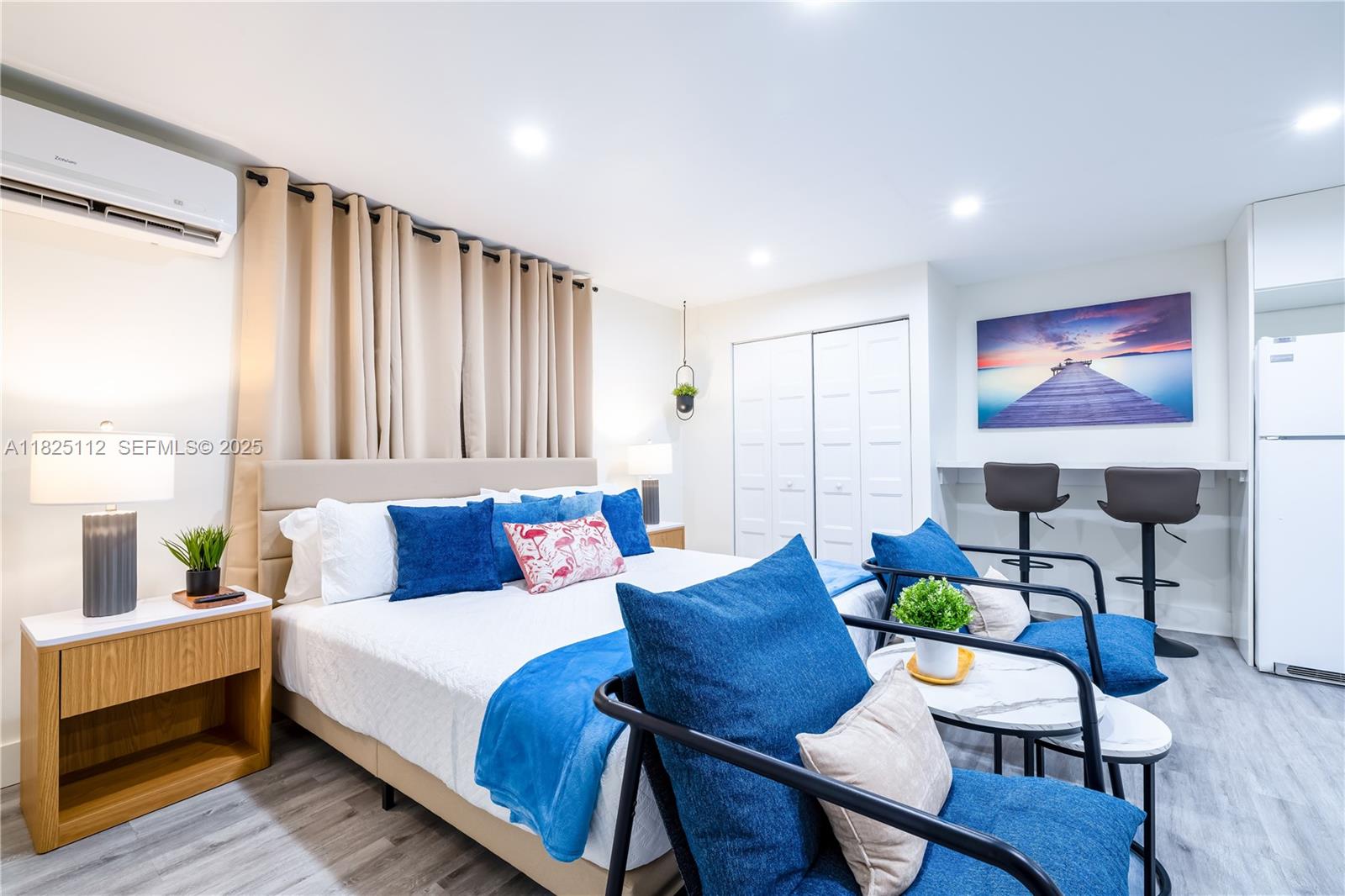 1836 Northwest 16th Terrace, Unit 3 Miami, FL 33125 - Photo 14 of 15 a bed room with furniture and a potted plant