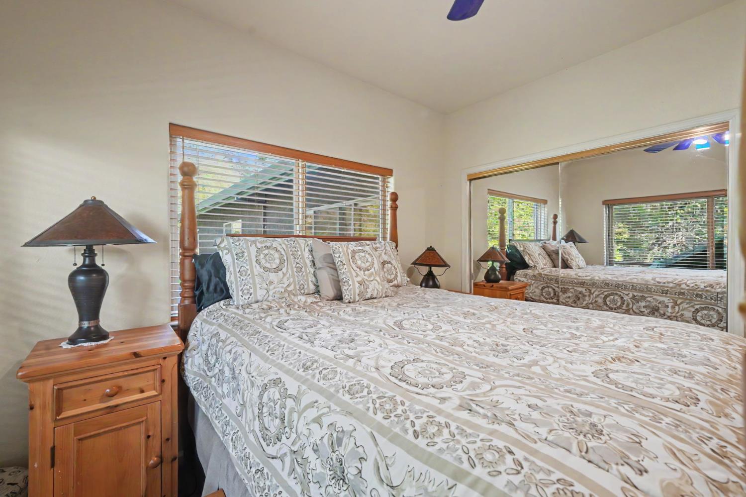 12091 Mierkey Road Jackson, CA 95642 - Photo 59 of 87 a bedroom with a large bed and a dresser