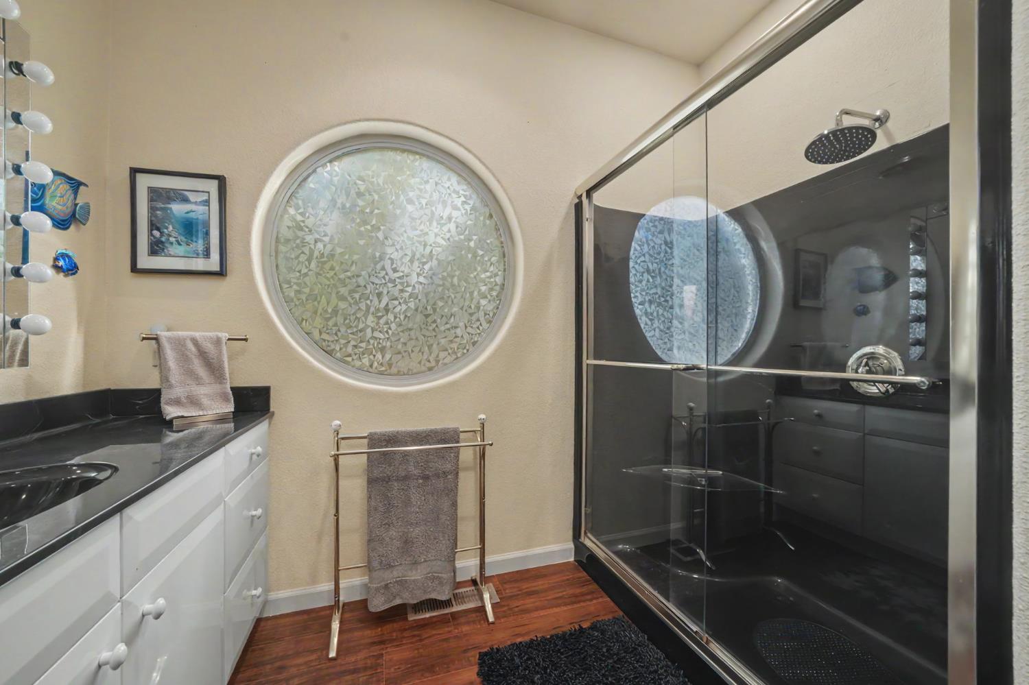 12091 Mierkey Road Jackson, CA 95642 - Photo 64 of 87 a bathroom with a mirror a sink and a mirror