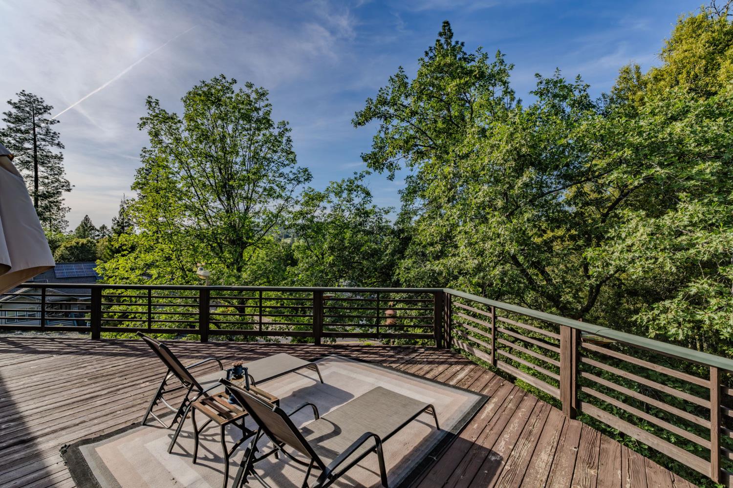 12091 Mierkey Road Jackson, CA 95642 - Photo 65 of 87 a view of balcony with wooden floor and outdoor seating