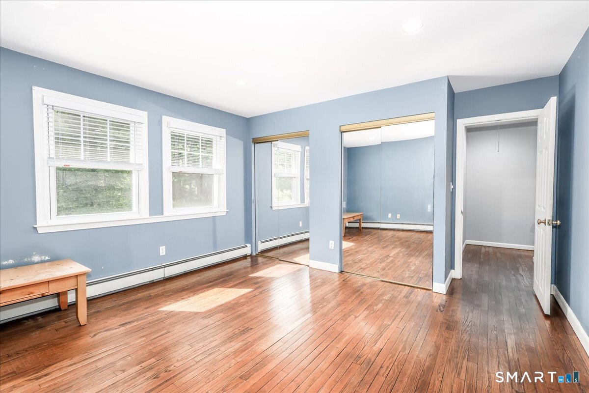 19 Botsford Hill Road Newtown, CT 06470 - Photo 26 of 40 an empty room with wooden floor and windows