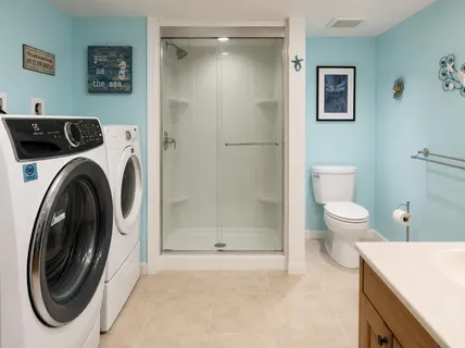 a bathroom with a toilet and a shower