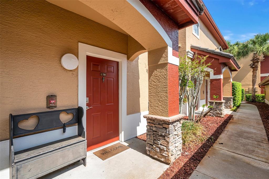 2245 Chianti Place, Unit 724 Palm Harbor, FL 34683 - Photo 1 of 76 a front view of a house with a yard