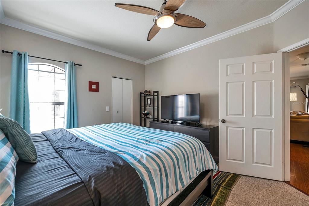 2245 Chianti Place, Unit 724 Palm Harbor, FL 34683 - Photo 29 of 76 a bedroom with a bed and a flat screen tv