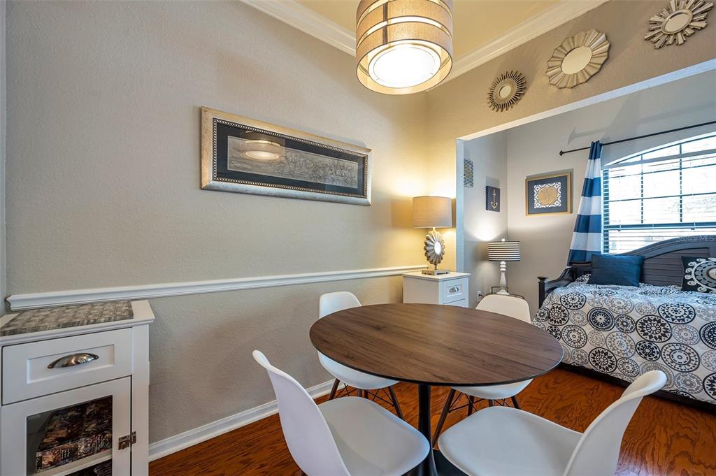2245 Chianti Place, Unit 724 Palm Harbor, FL 34683 - Photo 9 of 76 a view of a dining room with furniture