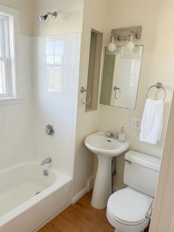 37 Madison Street, Unit 37 Malden, MA 02148 - Photo 4 of 10 a bathroom with a sink a toilet and shower