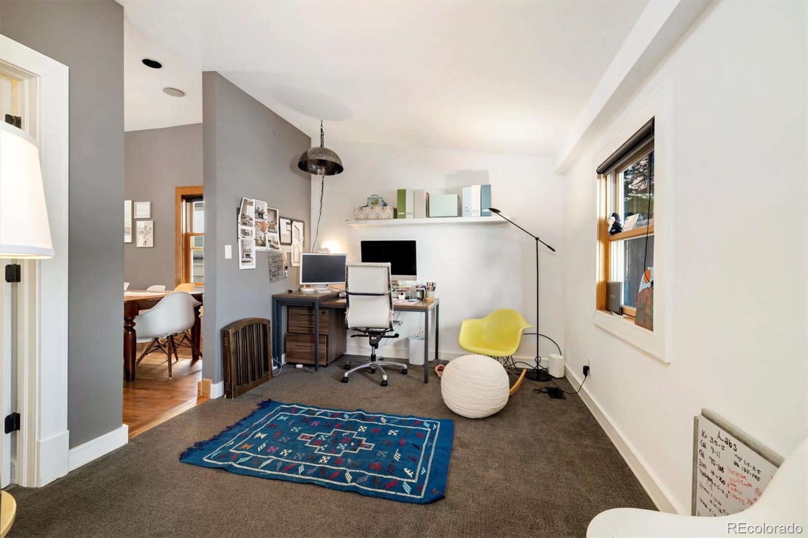 3122 Umatilla Street Denver, CO 80211 - Photo 11 of 19 a living room with furniture rug and a table