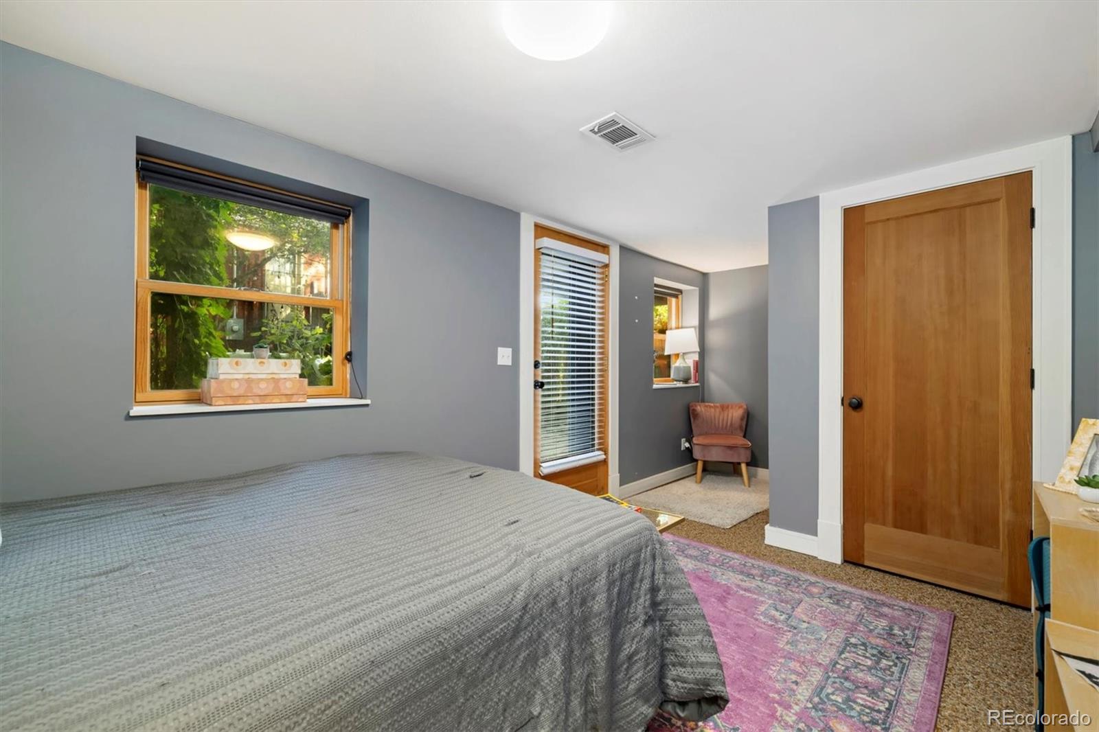 3122 Umatilla Street Denver, CO 80211 - Photo 12 of 19 a bed room with a bed and a window