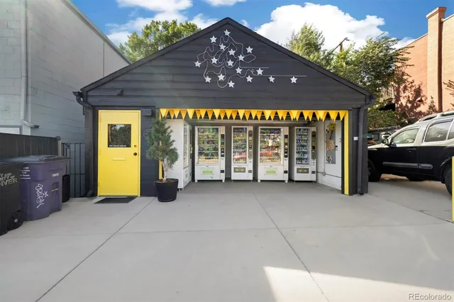 a view of a house with a porch and furniture