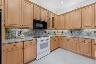 a living room with furniture and large windows