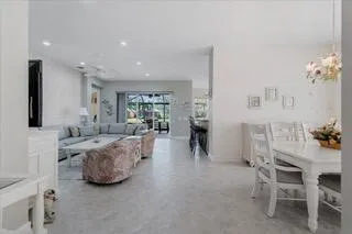 a kitchen with stainless steel appliances granite countertop a refrigerator sink and cabinets
