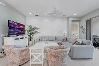 a kitchen with granite countertop white cabinets stainless steel appliances and sink