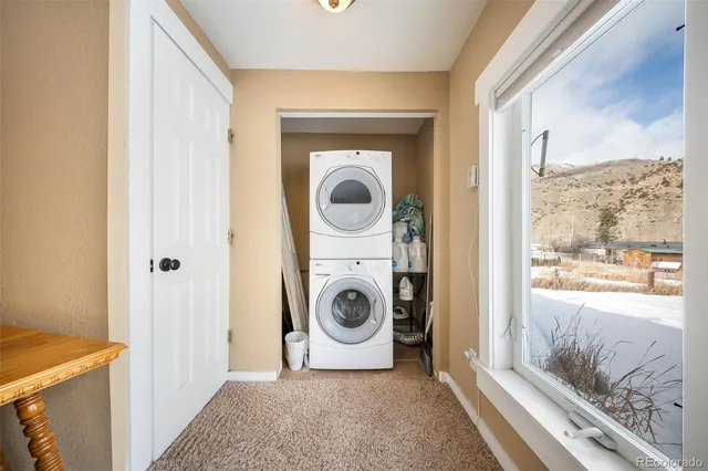 a view of a livingroom with furniture and a window