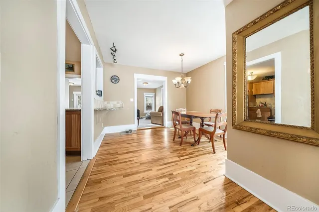 a view of a dining room with furniture and a table