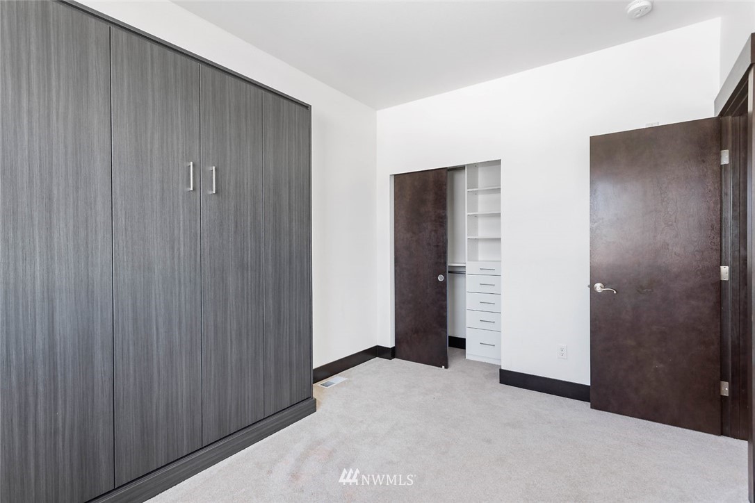 4004 Northeast 3rd Place Renton, WA 98056 - Photo 14 of 25 a view of a big room with closet and wooden door