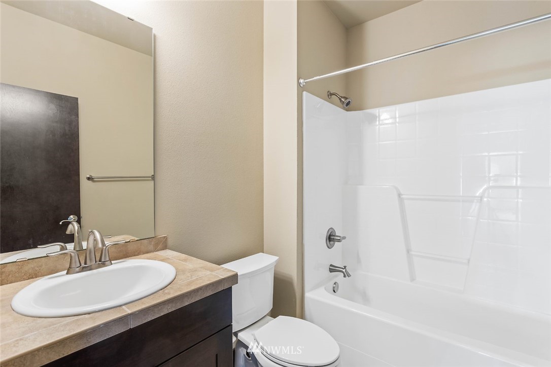 4004 Northeast 3rd Place Renton, WA 98056 - Photo 15 of 25 a bathroom with a sink toilet and shower