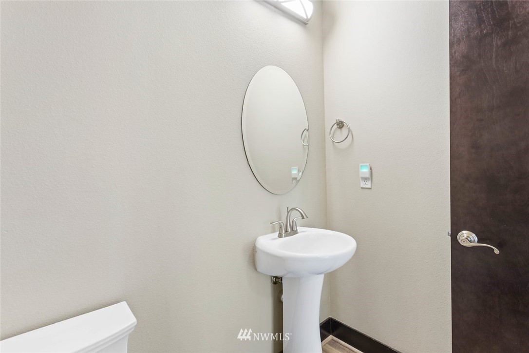 4004 Northeast 3rd Place Renton, WA 98056 - Photo 10 of 25 a bathroom with a sink and a mirror