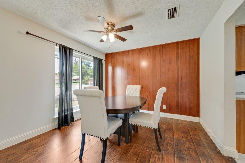 905 Pepperidge Court Lancaster, TX 75134 - Photo 3 of 19 a view of a dining room with furniture window and wooden floor