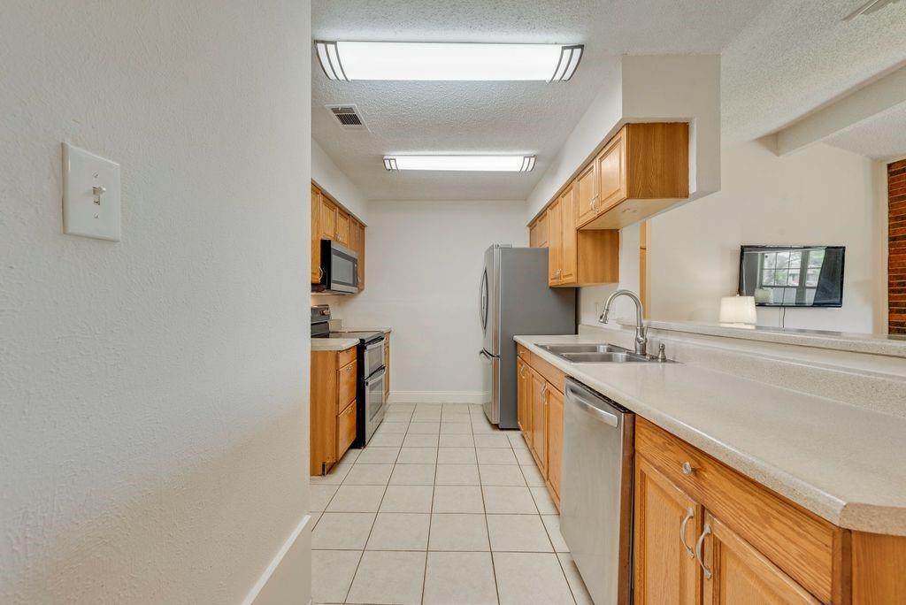 905 Pepperidge Court Lancaster, TX 75134 - Photo 5 of 19 a spacious bathroom with a sink a large mirror and a shower