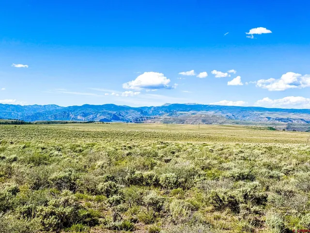 a view of an ocean and a mountain