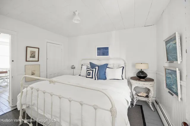 a bed room with a bed and a tv