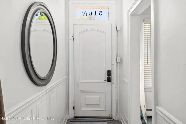 a view of a hallway with washer and dryer
